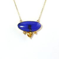 Lapis frequently contains varying amounts of whitish calcite matrix—the host rock that surrounds the gem—or flecks or veins of glinting yellow pyrite, or both.