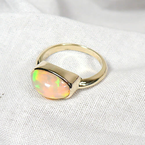 14k Handmade Bezel Ring with Oval Ethiopian Opal Cabochon in Yellow Gold