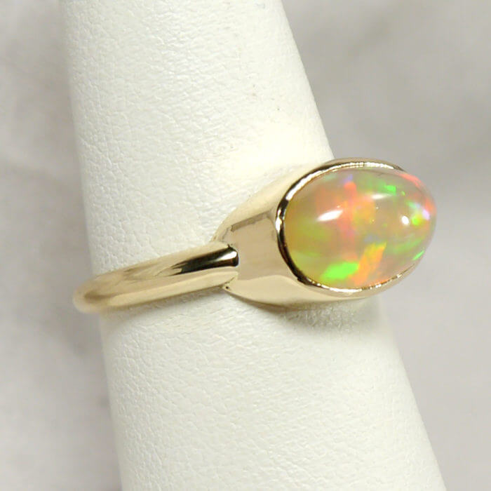14k Handmade Bezel Ring with Oval Ethiopian Opal Cabochon in Yellow Gold