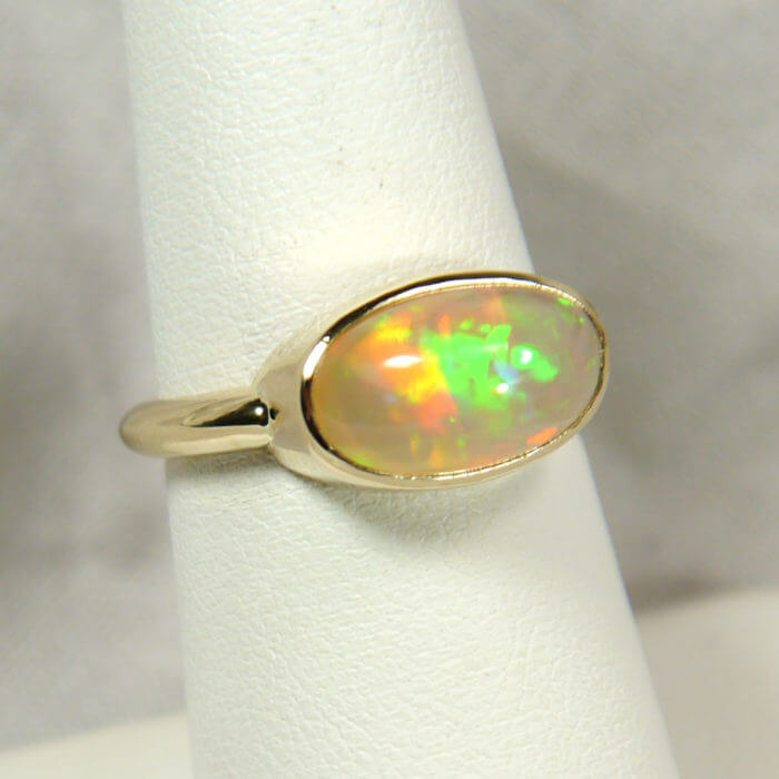 14k Handmade Bezel Ring with Oval Ethiopian Opal Cabochon in Yellow Gold