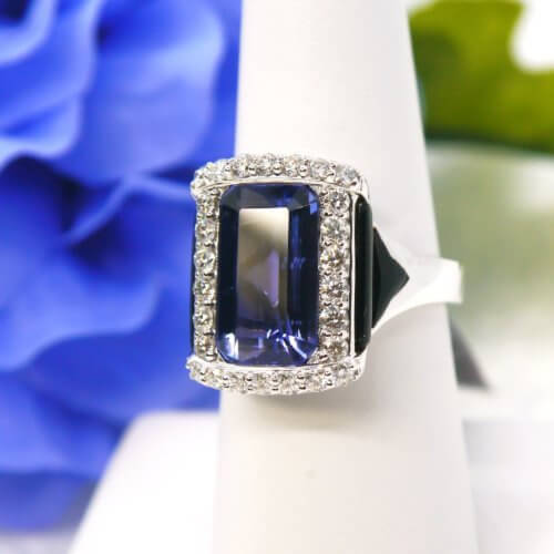 5.23ct Tanzanite, Onyx, and Diamond Halo Ring in 18k White Gold