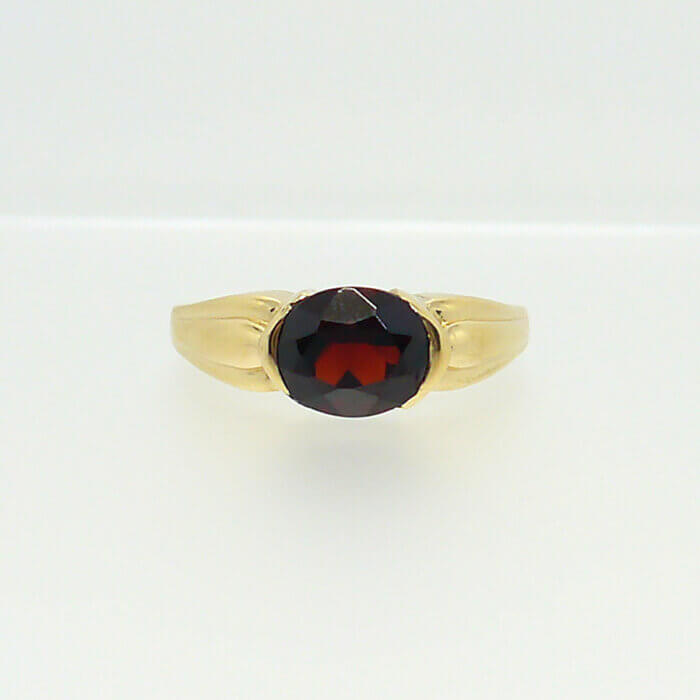 Oval Garnet 14k Yellow Gold East West Half Bezel Gemstone Ring