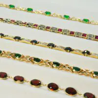 Synthetic Oval Emerald & Diamond Infinity Bracelet in 10k Yellow Gold - Image 2
