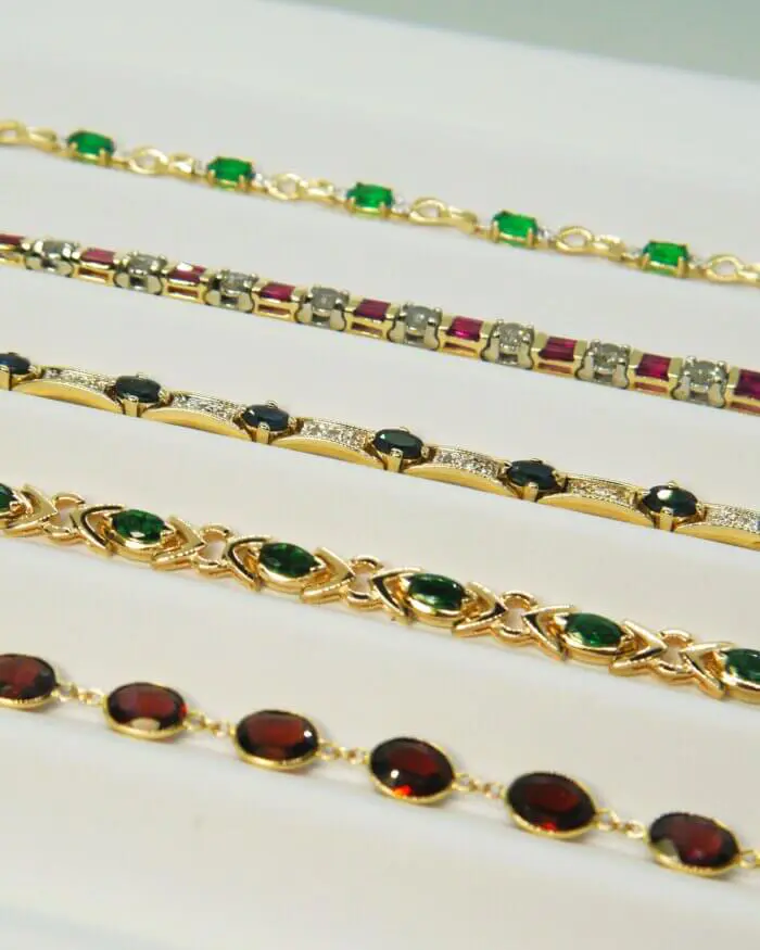 Synthetic Oval Emerald & Diamond Infinity Bracelet in 10k Yellow Gold - Image 2