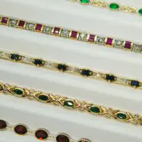 Synthetic Oval Emerald & Diamond Infinity Bracelet in 10k Yellow Gold - Image 3